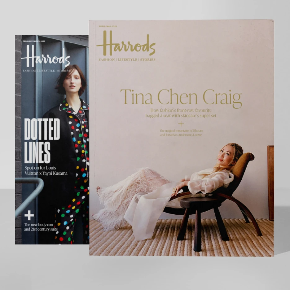 Two luxury fashion magazines displayed side by side: one featuring a model in a patterned coat photographed in an urban setting, and the other featuring a woman reclining in a sculptural chair, styled in a soft, minimalist editorial interior.